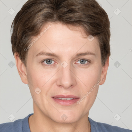 Joyful white adult male with short  brown hair and grey eyes