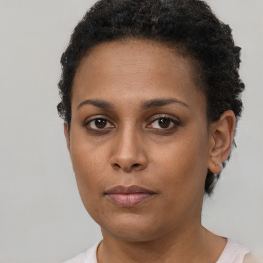 Neutral black young-adult female with short  brown hair and brown eyes