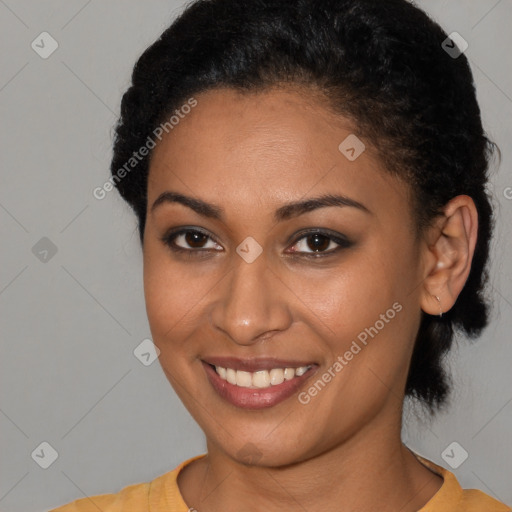 Joyful latino young-adult female with short  black hair and brown eyes