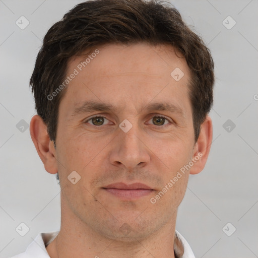 Joyful white adult male with short  brown hair and brown eyes