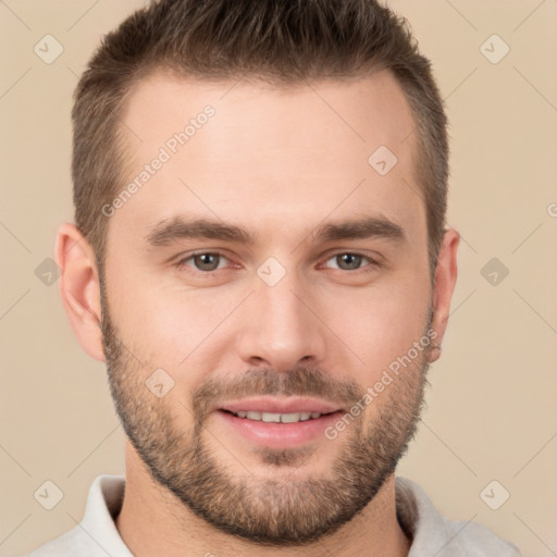 Joyful white young-adult male with short  brown hair and brown eyes