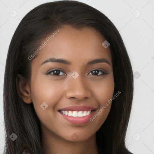 Joyful latino young-adult female with long  brown hair and brown eyes