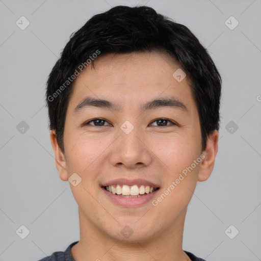 Joyful asian young-adult male with short  black hair and brown eyes