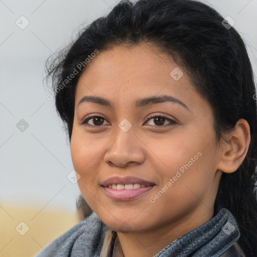 Joyful latino young-adult female with long  brown hair and brown eyes