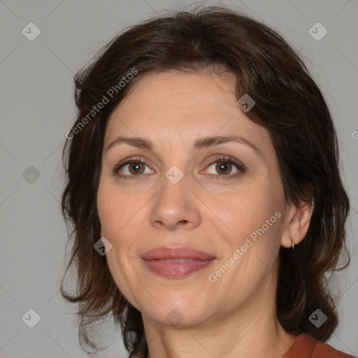 Joyful white adult female with medium  brown hair and brown eyes