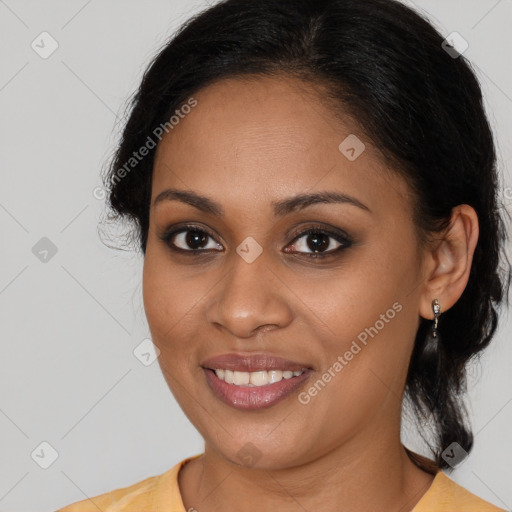 Joyful latino young-adult female with long  brown hair and brown eyes