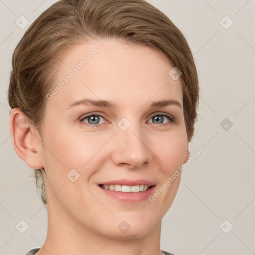 Joyful white young-adult female with short  brown hair and grey eyes