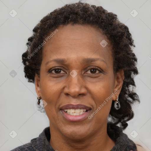 Joyful black adult female with medium  brown hair and brown eyes