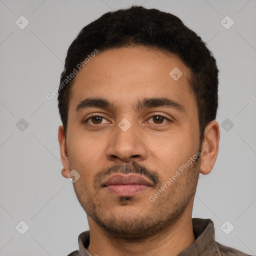 Neutral latino young-adult male with short  black hair and brown eyes