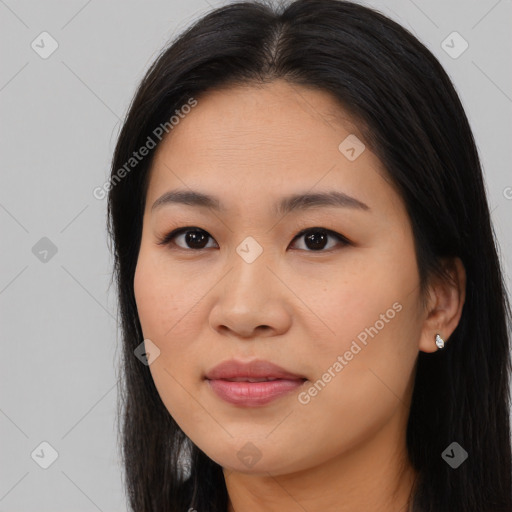 Joyful asian young-adult female with long  brown hair and brown eyes