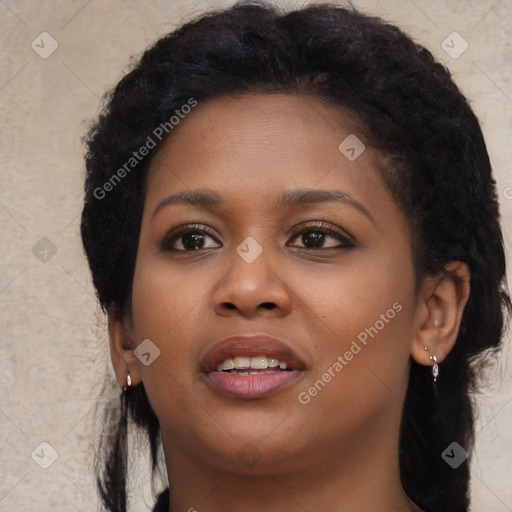Joyful black young-adult female with long  brown hair and brown eyes