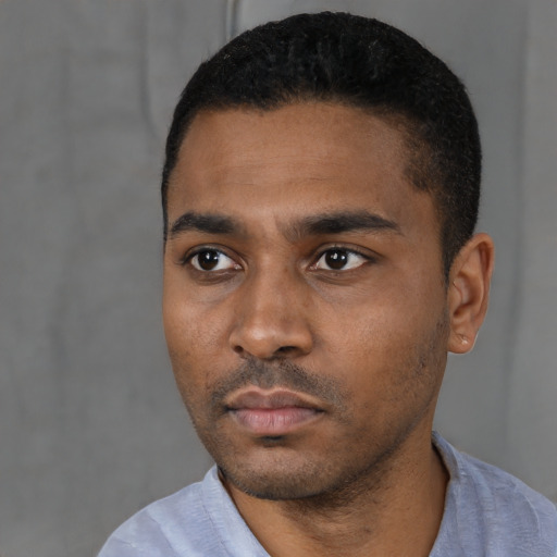 Neutral black young-adult male with short  black hair and brown eyes