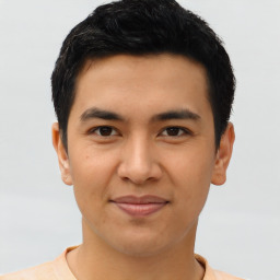 Joyful asian young-adult male with short  brown hair and brown eyes