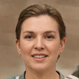 Joyful white adult female with short  brown hair and brown eyes