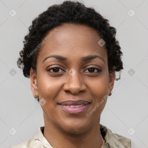 Joyful black young-adult female with short  brown hair and brown eyes