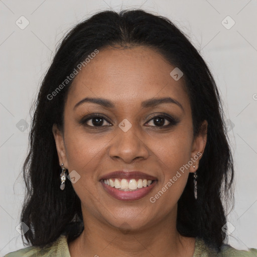 Joyful black young-adult female with long  brown hair and brown eyes