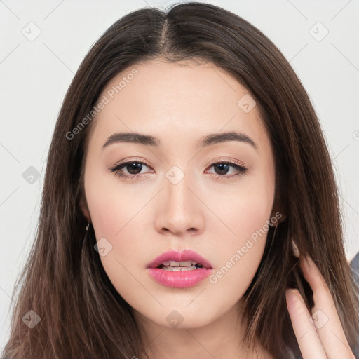 Neutral white young-adult female with long  brown hair and brown eyes