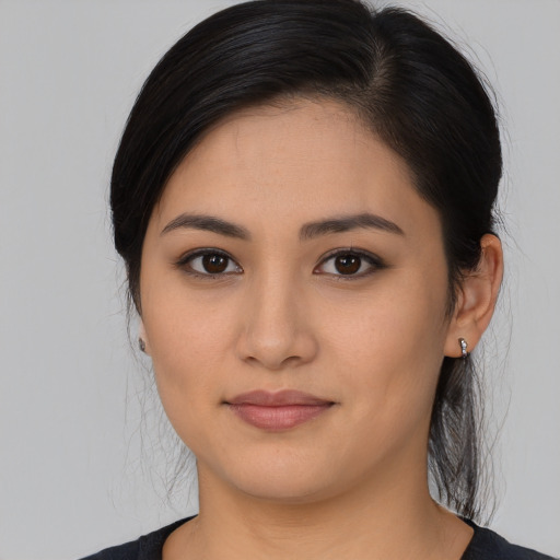 Joyful asian young-adult female with medium  brown hair and brown eyes
