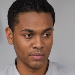 Neutral black young-adult male with short  brown hair and brown eyes