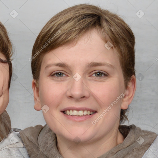 Joyful white young-adult female with medium  brown hair and blue eyes