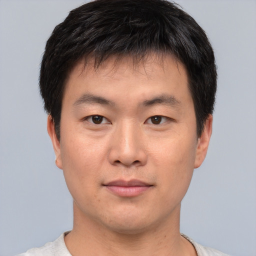 Neutral asian young-adult male with short  brown hair and brown eyes