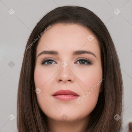 Neutral white young-adult female with long  brown hair and brown eyes