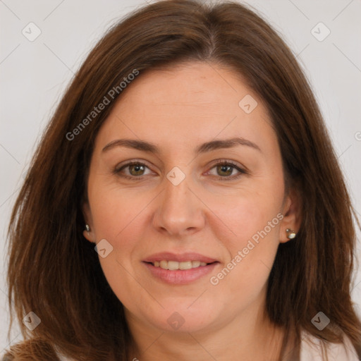 Joyful white adult female with long  brown hair and brown eyes