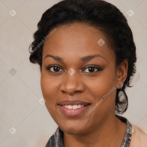 Joyful black young-adult female with medium  brown hair and brown eyes