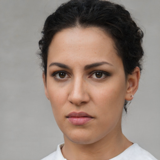 Neutral latino young-adult female with short  brown hair and brown eyes
