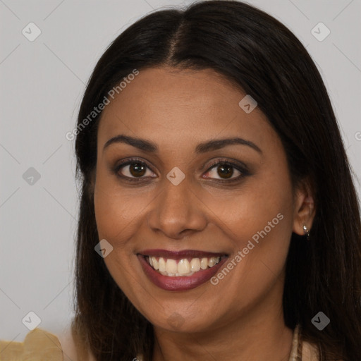 Joyful latino young-adult female with long  brown hair and brown eyes