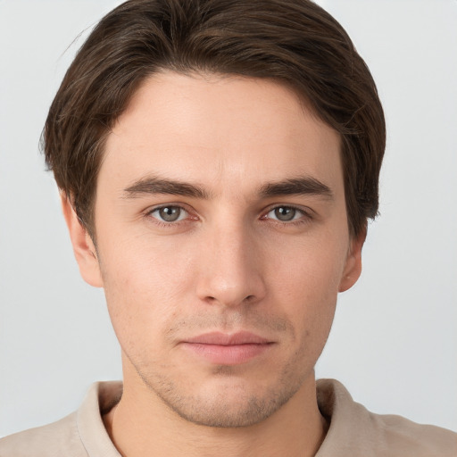 Neutral white young-adult male with short  brown hair and grey eyes