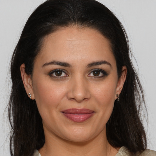 Joyful white adult female with medium  brown hair and brown eyes