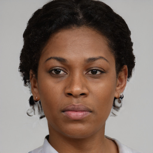 Neutral black young-adult female with short  brown hair and brown eyes