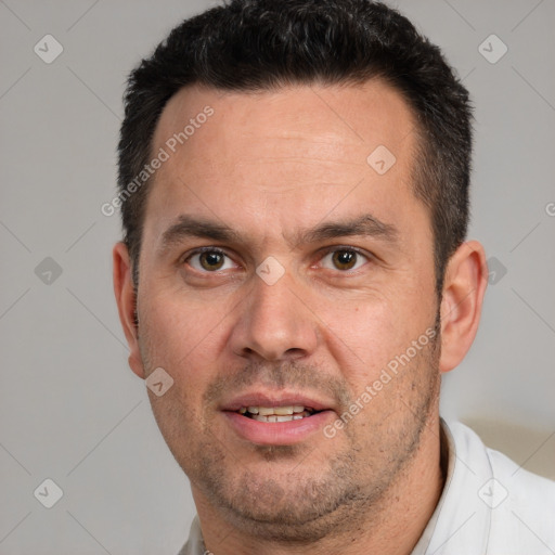 Joyful white adult male with short  brown hair and brown eyes