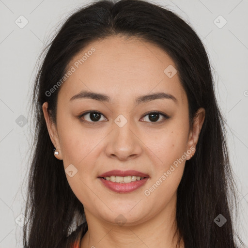 Joyful latino young-adult female with long  brown hair and brown eyes