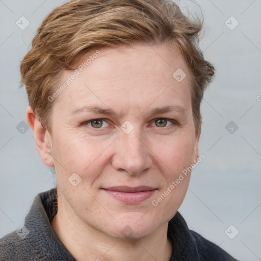 Joyful white adult female with short  brown hair and grey eyes