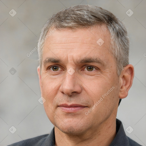 Joyful white middle-aged male with short  brown hair and brown eyes