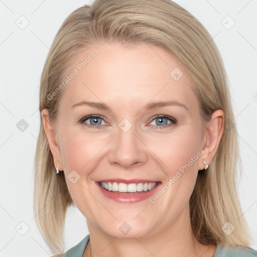 Joyful white young-adult female with medium  brown hair and blue eyes