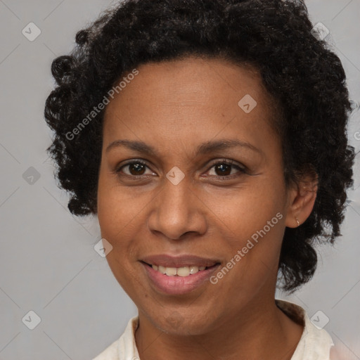 Joyful black adult female with short  brown hair and brown eyes