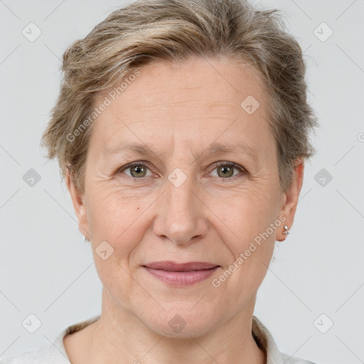 Joyful white adult female with short  brown hair and grey eyes