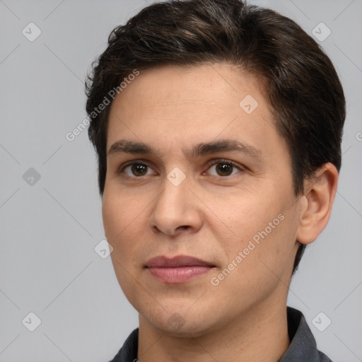 Joyful white adult male with short  brown hair and brown eyes