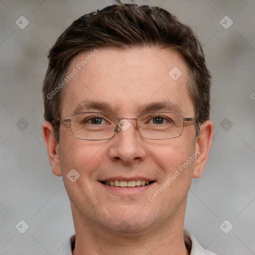 Joyful white adult male with short  brown hair and grey eyes