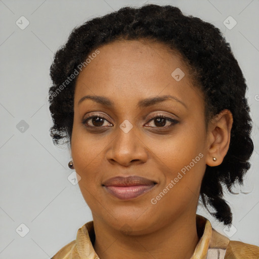 Joyful black young-adult female with long  brown hair and brown eyes