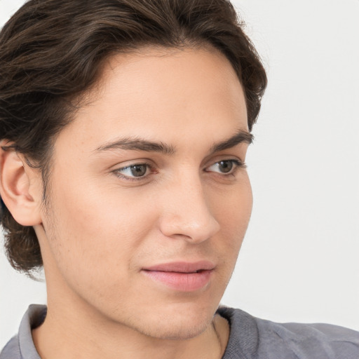 Joyful white young-adult male with medium  brown hair and brown eyes