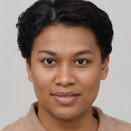 Joyful latino young-adult female with short  brown hair and brown eyes