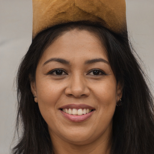 Joyful asian young-adult female with long  brown hair and brown eyes