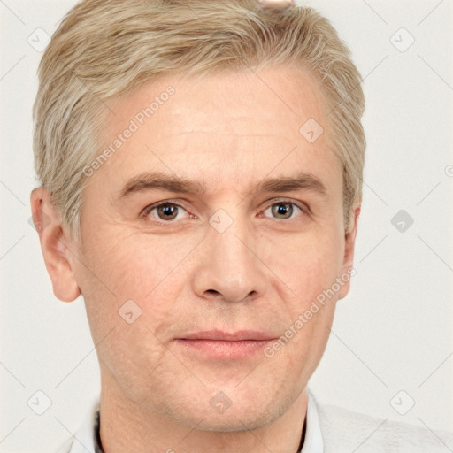 Joyful white adult male with short  brown hair and grey eyes