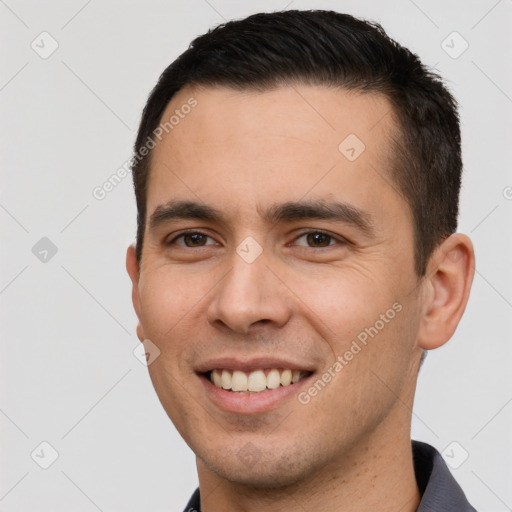 Joyful white young-adult male with short  brown hair and brown eyes