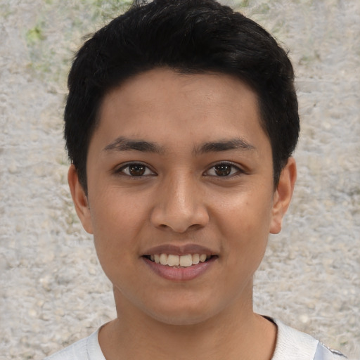 Joyful latino young-adult female with short  black hair and brown eyes
