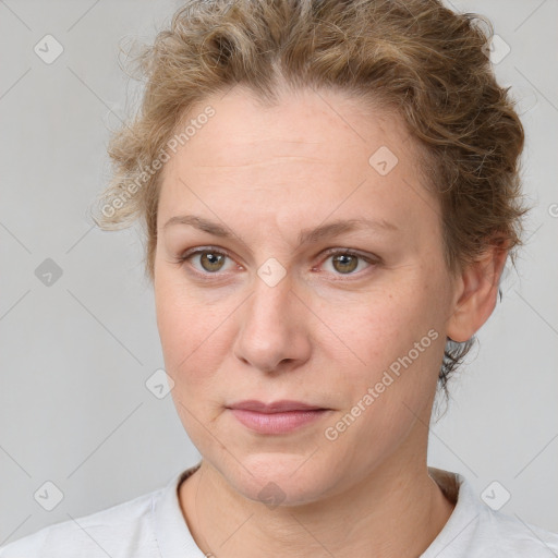 Joyful white adult female with short  brown hair and brown eyes